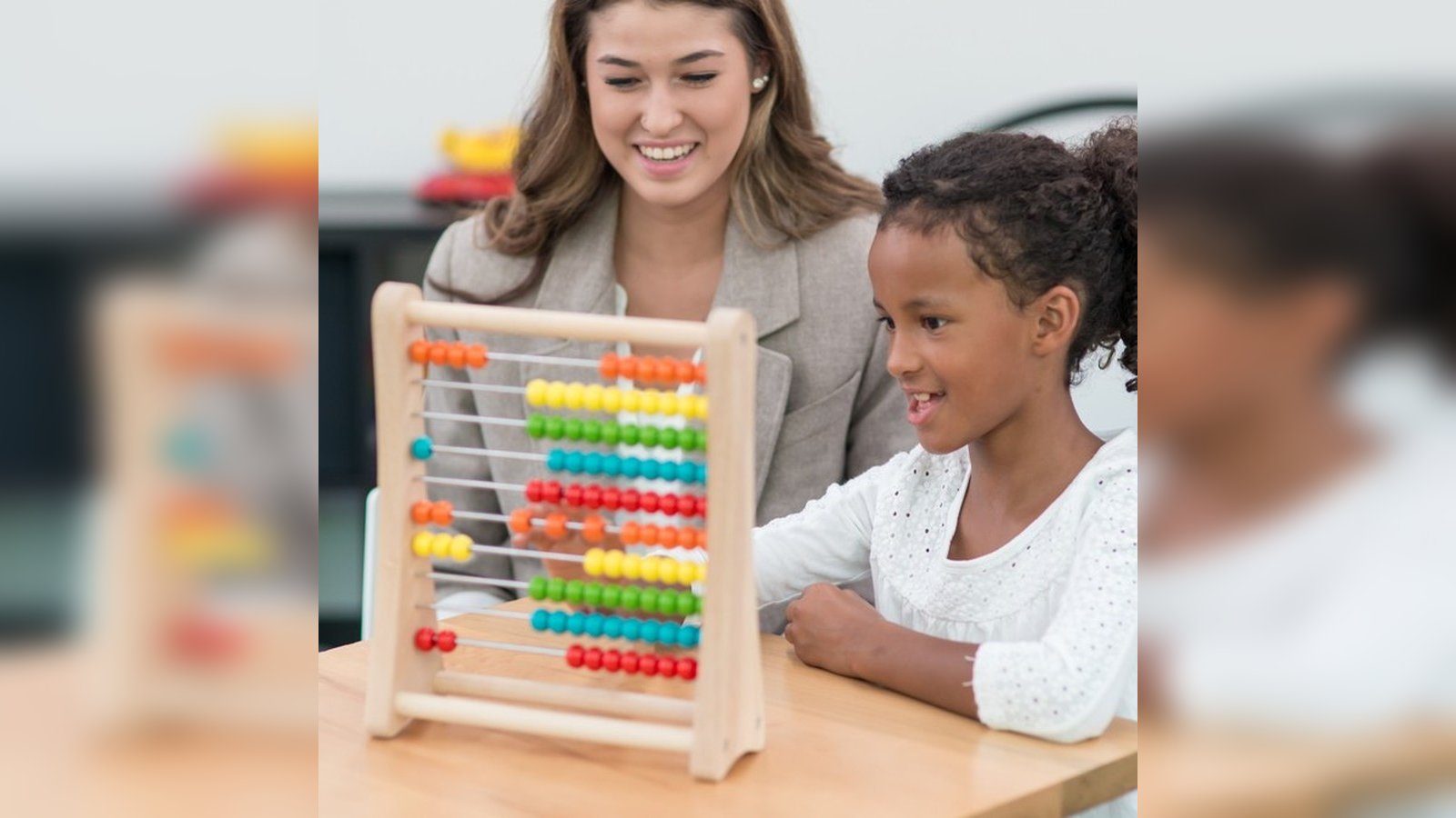 Caregiver supporting a child during occupational therapy