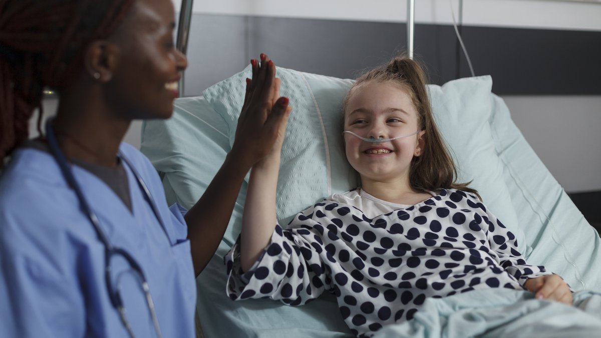 Nurse sharing a reassuring moment with a child